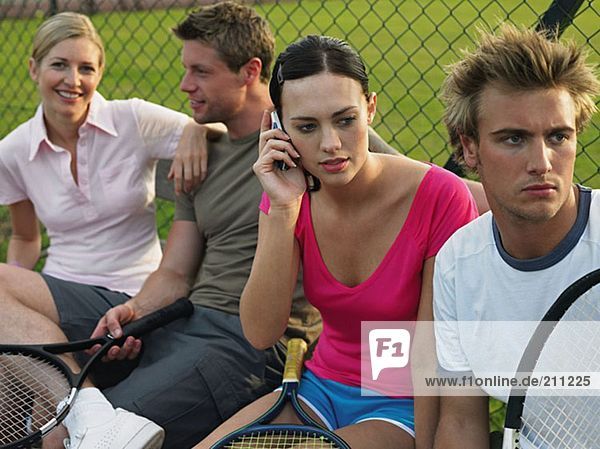 Young people at tennis court