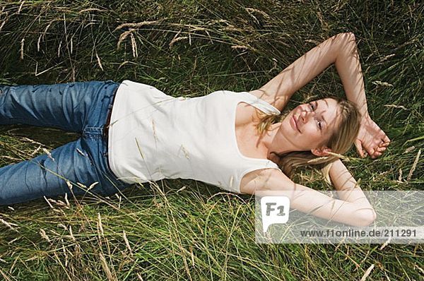 Woman lying in a field