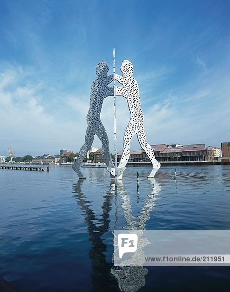 Molecule men sculpture in river  Spree River  Treptow  Berlin  Germany