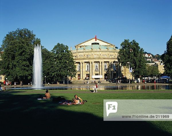 People resting near fountain in garden  Stuttgart  Baden-Wuerttemberg  Germany