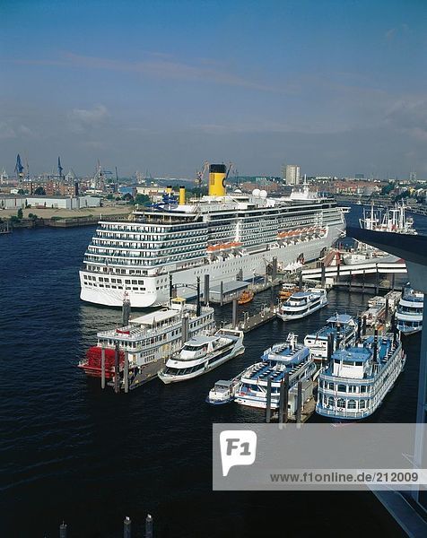 Cruise ship and tourboats at harbor  St Pauli  Hamburg  Germany