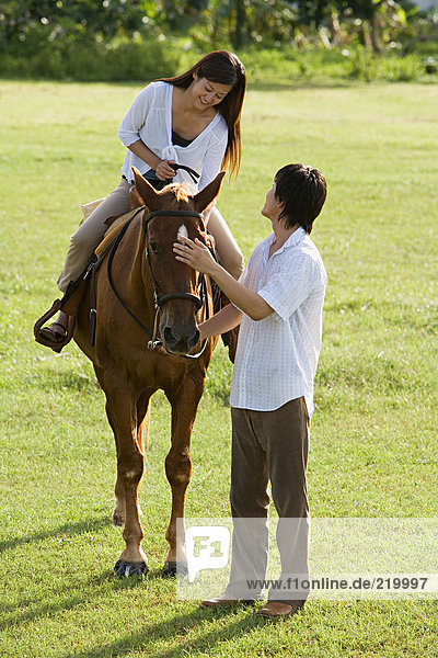 Couple horse riding