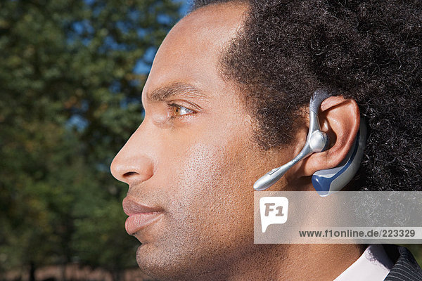 Businessman wearing a bluetooth headset