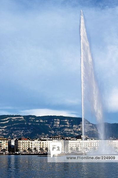 Fountain in lake at waterfront spraying water  Geneve  Switzerland