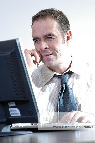 Close-up of businessman working on computer