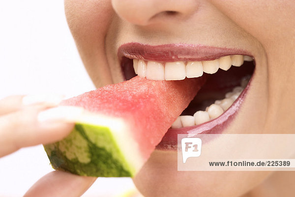 Close-up of woman eating watermelon