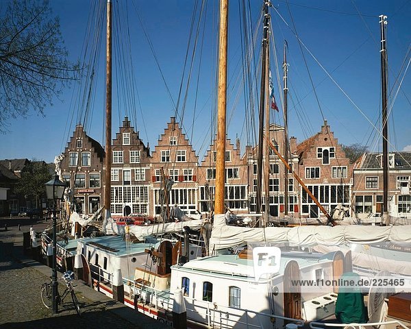Boats moored at harbor  Ijssel River  Netherlands