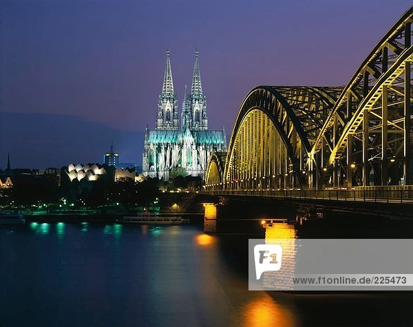 Railroad Bridge across river at dusk  Hohenzollern Bridge  Cologne  Germany