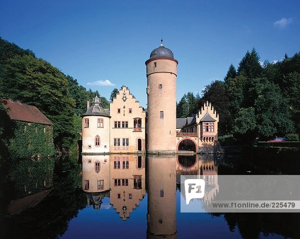 Reflection of castle in water  Mespelbrunn Castle  Mespelbrunn  Aschaffenburg District  Bavaria  Germany