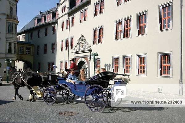 Tourists on horse drawn carriage  Weimar  Germany