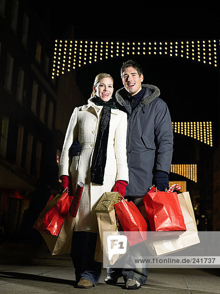 Mid adult couple christmas shopping