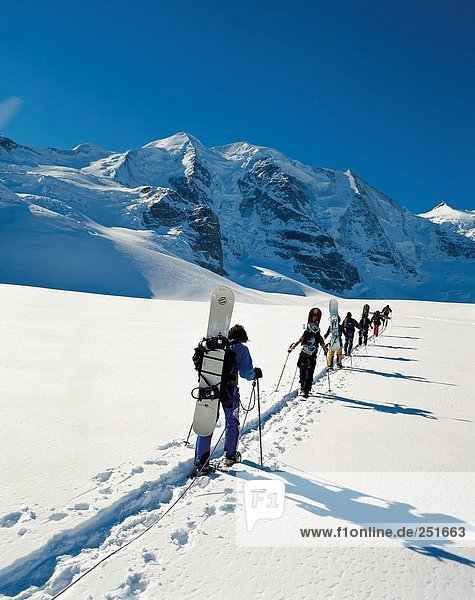 10332477  winter sports  sport  Bernina area  behind  Piz Palu  canton carry  wear  Graubunden  Grisons  Switzerland  Europe