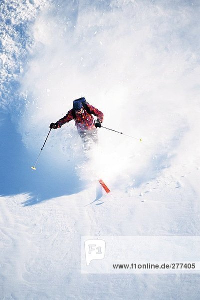A man skiing off-piste.