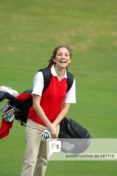 Happy female golfer
