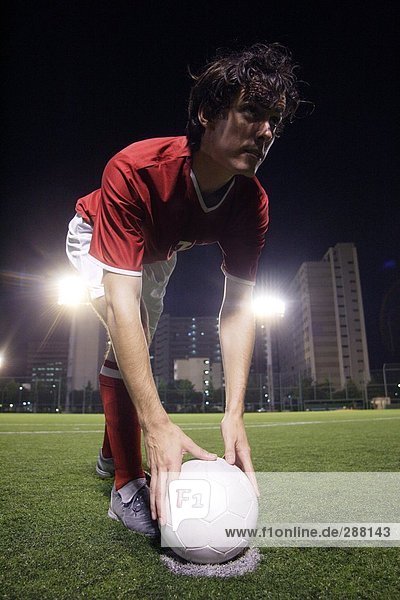 Soccer Player Setting A Penalty Kick