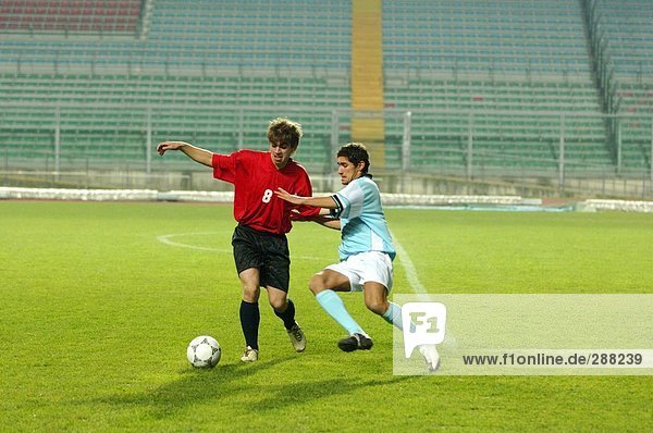 Soccer Player Tackling