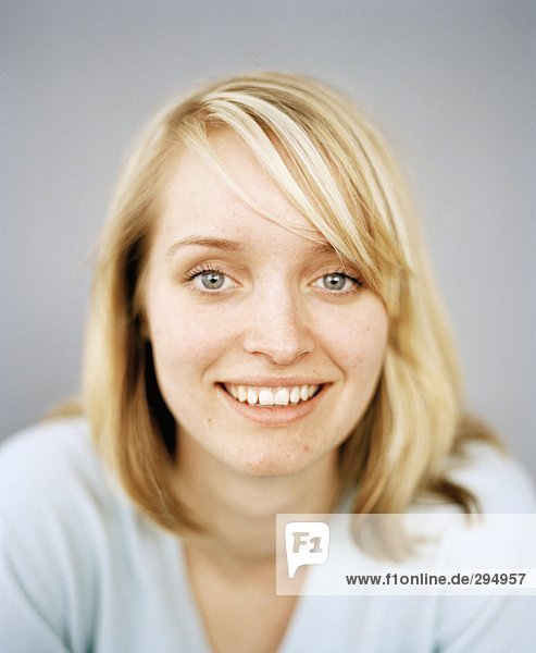 A smiling blond woman portrait.