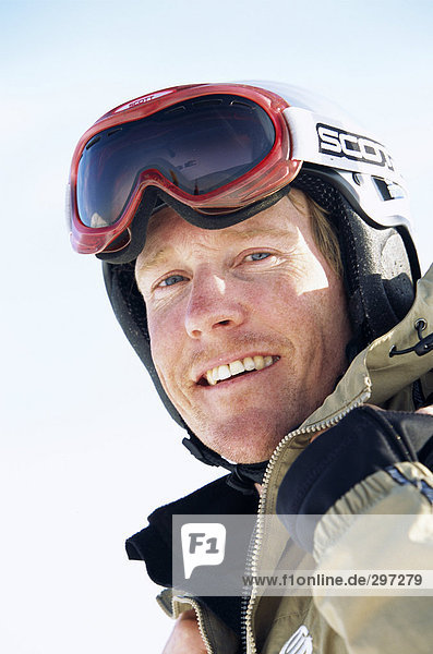 Portrait of a man wearing ski goggles.