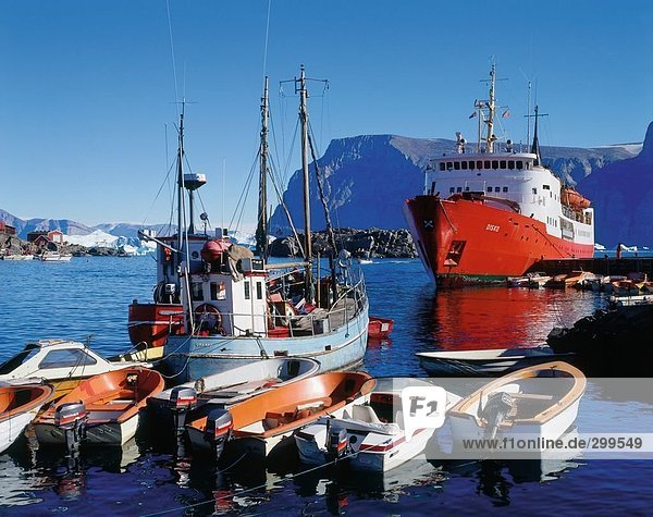 Boats with cruise ship on harbor  Uummannaq  Qaasuitsup  Greenland