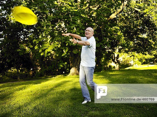 A man throwing a Frisbee.