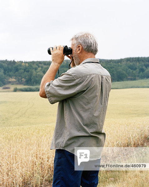 A man with binoculars.