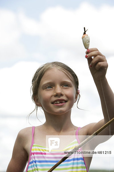 A girl with a fishing-tackle.