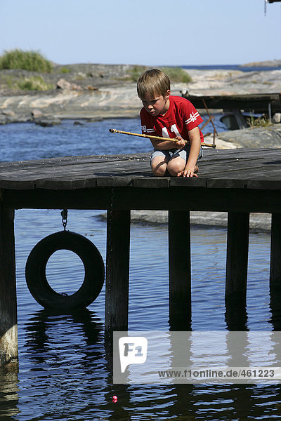 A boy fishing.