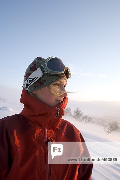 Portrait of a woman with ski goggles.