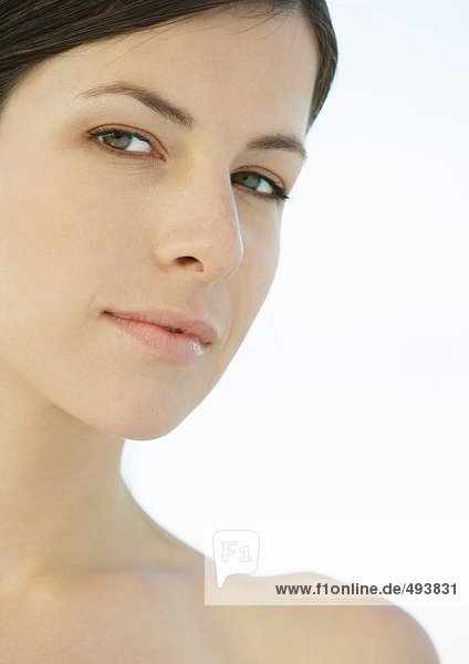 Woman's face and shoulder  close-up