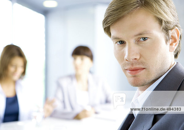 Businessman  meeting in background