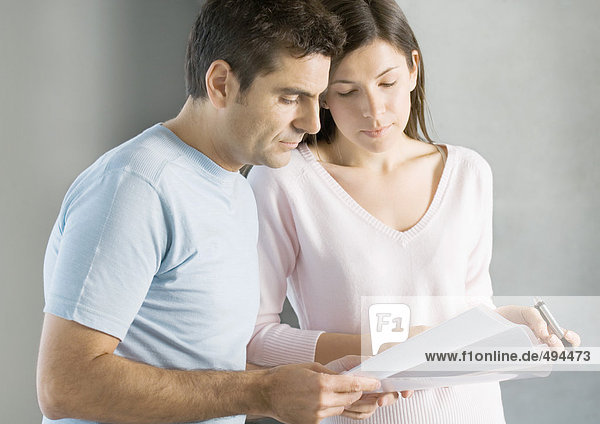 Couple looking at documents