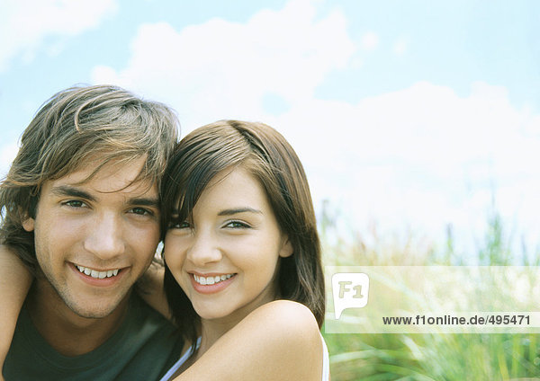 Young couple smiling  outdoors