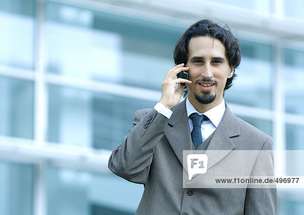 Businessman using cell phone  portrait