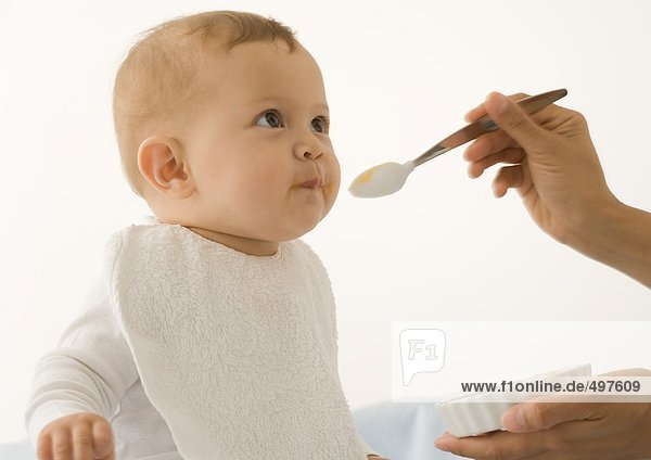 Baby being fed