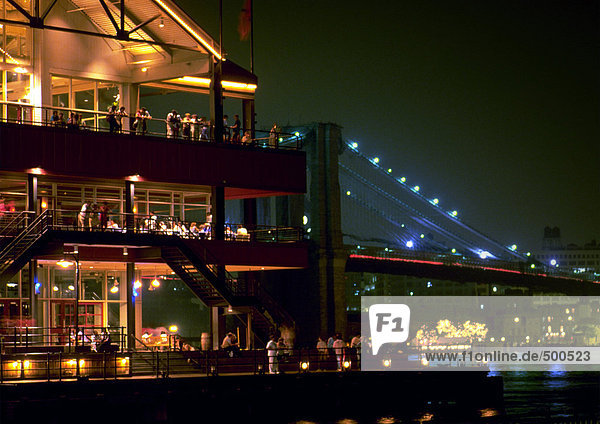 New York  Manhattan  South Street Seaport and Brooklyn Bridge  illuminated at night