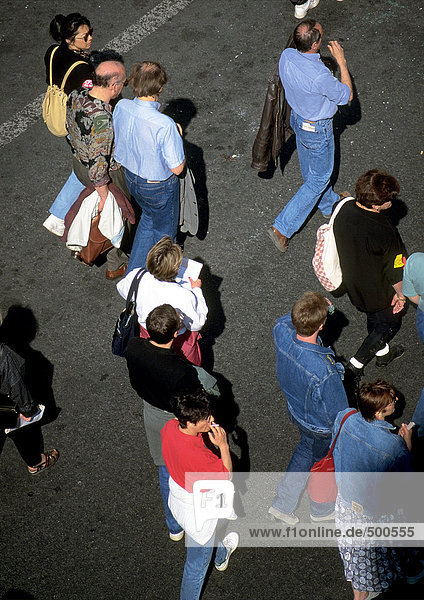 Group of people standing on asphalt  high angle view