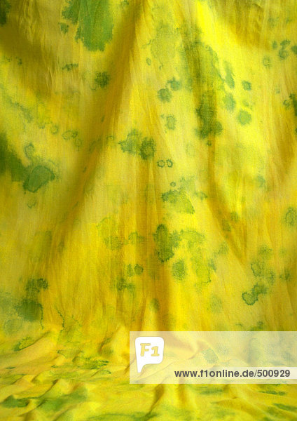 Gelber Stoff mit grünen Flecken,  Nahaufnahme,  Vollbild
