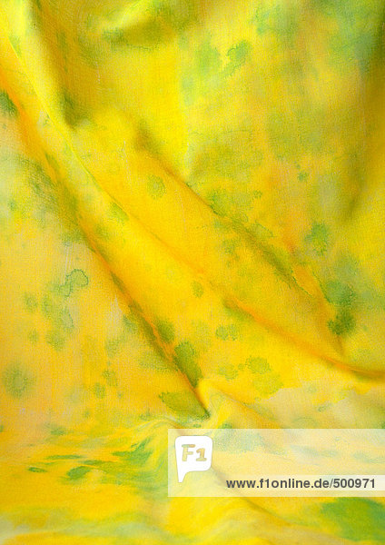 Gelber Stoff mit grünen Flecken,  Nahaufnahme,  Vollbild