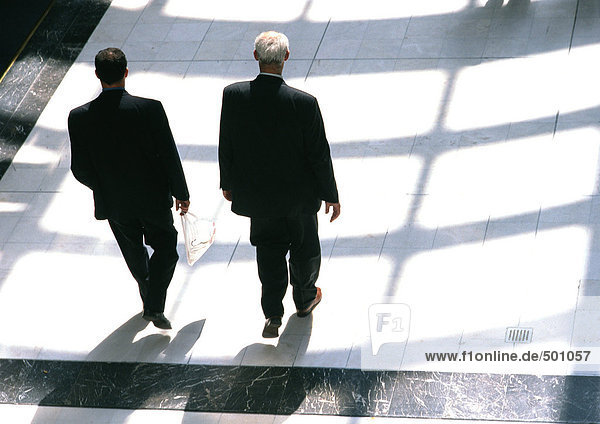 Businessmen walking together  view from above.