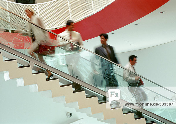 Business people on stairs  blurred