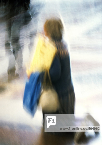 Woman kneeling  blurred