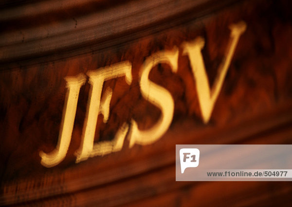Jesus inscribed in Latin  close-up  blurred