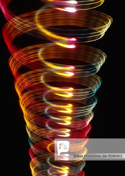 Spiralförmiger Lichteffekt  einer in dem anderen  Rot  Gelb und Blautöne.