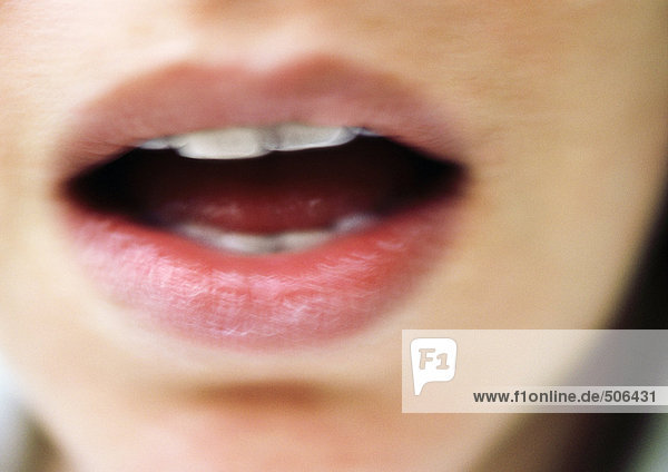 Close up of woman's open mouth  blurry. mouth