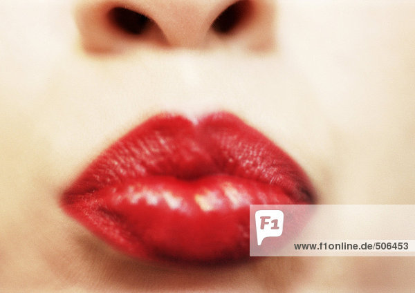 Close up of woman's mouth with red lipstick  blurry. mouth