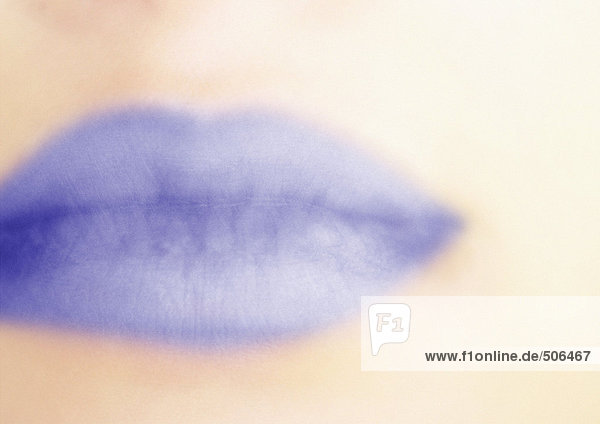 Close up of woman's mouth with blue lipstick. mouth