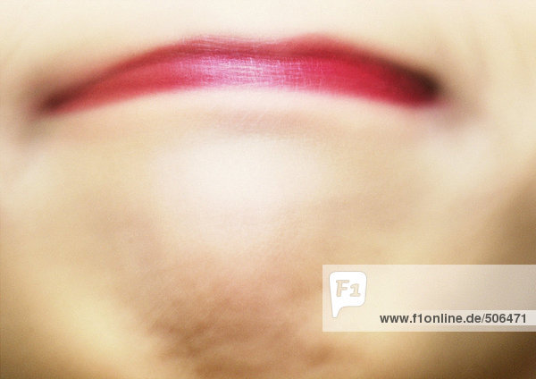 Close up of woman's mouth with pursed lips. mouth
