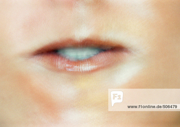 Close up of woman's mouth making expression. mouth