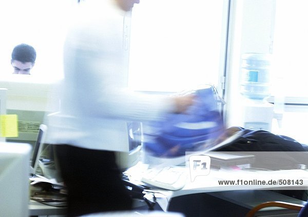 People working in office  blurred motion