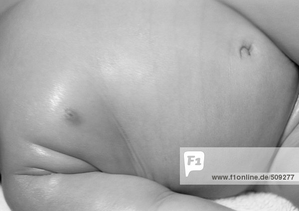 Baby's torso,  partial view,  close-up,  b&w